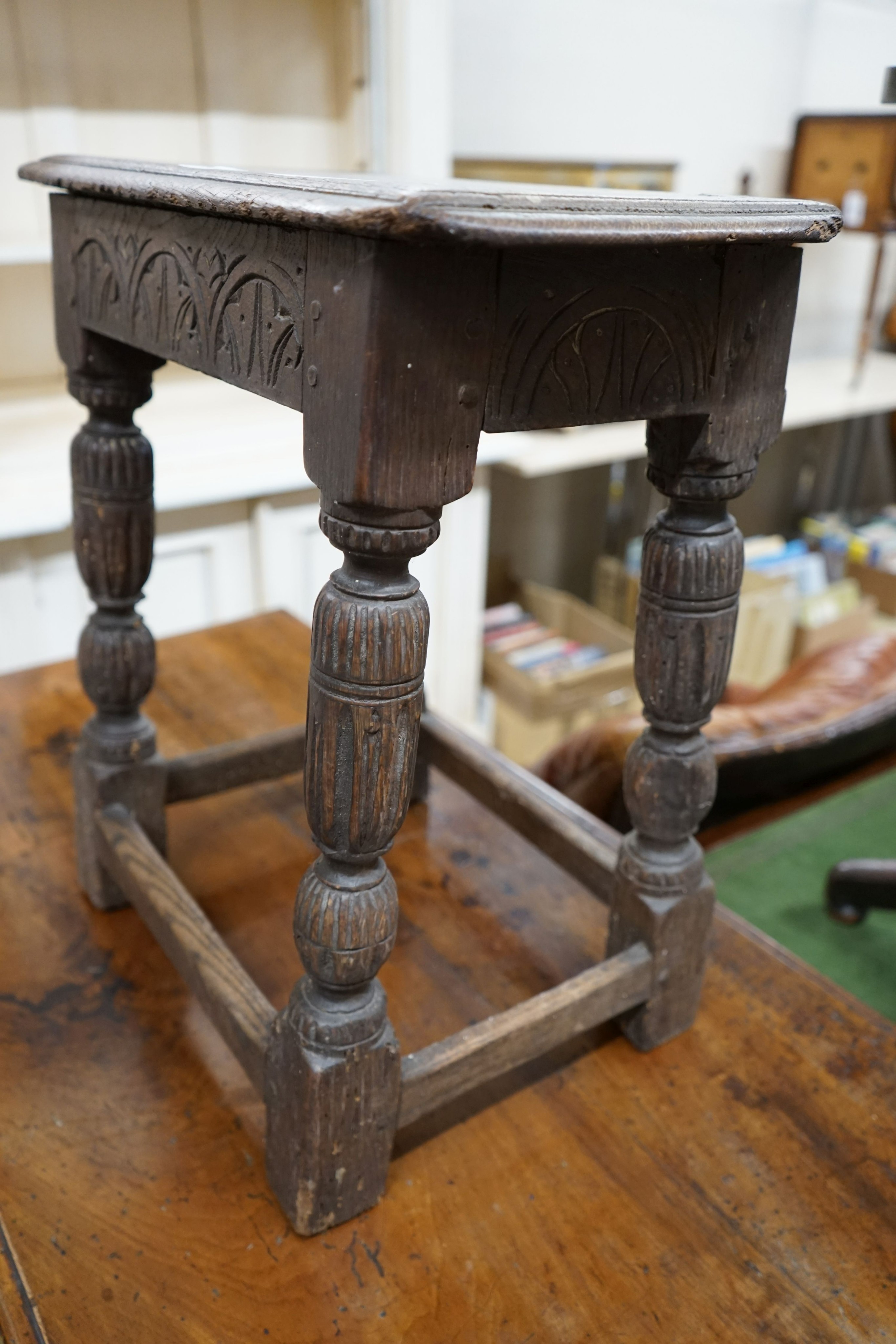 An oak joint stool (wormed), width 45cm, depth 27cm, height 52cm